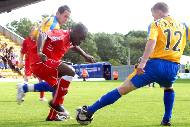 Craig Armstrong gets his foot to the ball.