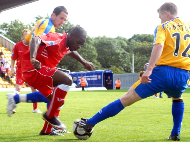 Craig Armstrong gets his foot to the ball.