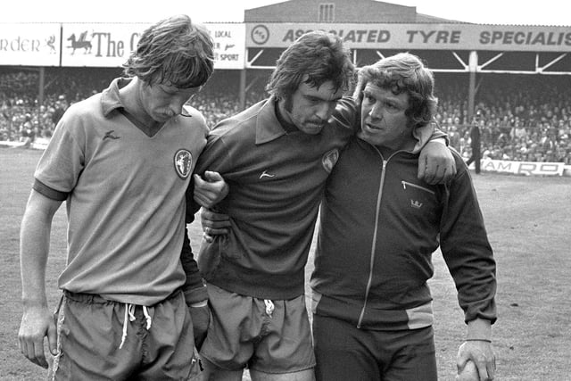 Rod Arnold is taken off the field with concussion at Wrexham in May 1977.