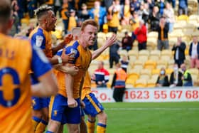 Mansfield Town's players celebrate their dramatic winner. Pic by The Bigger Picture.