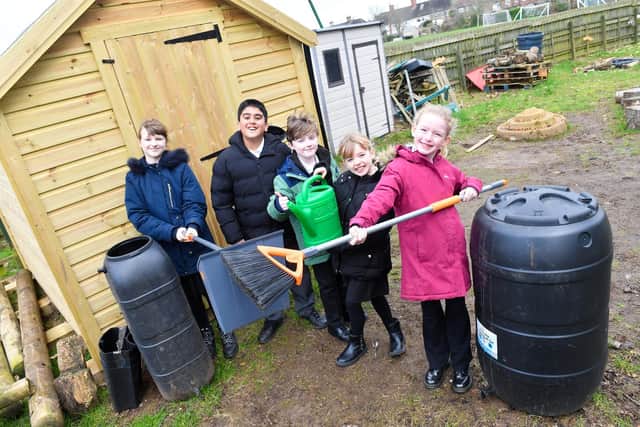 Pictured with some of the equipment and pupils from the school is teaching assistant and Eco leader Alison Fletcher.