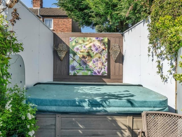 Other prized assets in the garden include this secluded hot-tub, a shed or outhouse with power, light and storage, a feature pond and well-stocked borders with a range of plants, trees and shrubs.