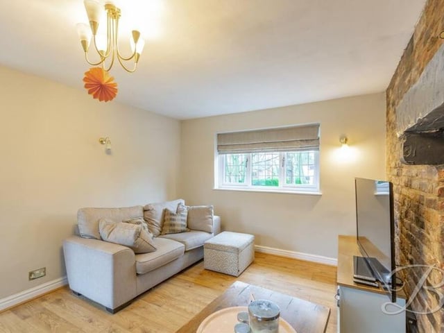 On cold winter's evenings like these, why not relax in front of the telly in the £450,000 property's warm living room?