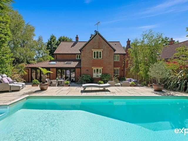 A remarkable executive detached family property enjoying a luxury lifestyle in a private and premium address in a plot of one-fifth of an acre that comes with ample private parking and integral oversized double garaging. The rear garden has immaculate hard landscaping and a fabulous terrace steps up to an enviable low-maintenance heated outdoor swimming pool within a secure fence and hedge surround. Breathing an air of exclusivity and boasting a private and peaceful fifth of an acre plot, this is surely one of the village's most desirable addresses.