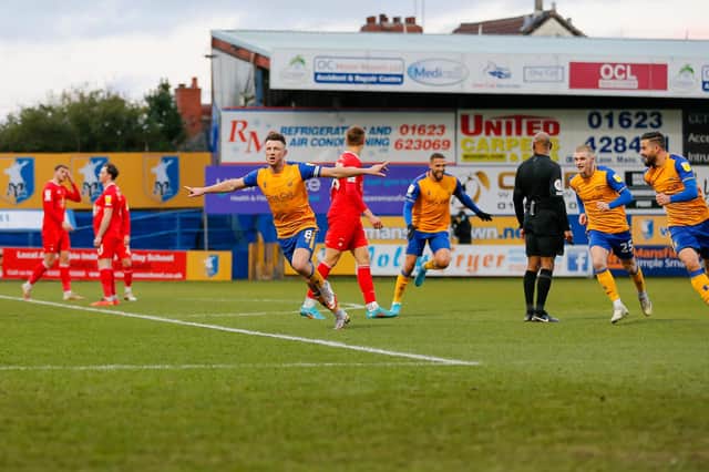 Mansfield Town midfielder Ollie Clarke  turns to face the fans after scoring Stags' second goal. Photo by Chris Holloway/The Bigger Picture.media