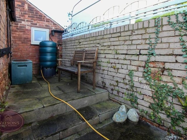 Stepping outside, this is a seating area that offers a high level of privacy.