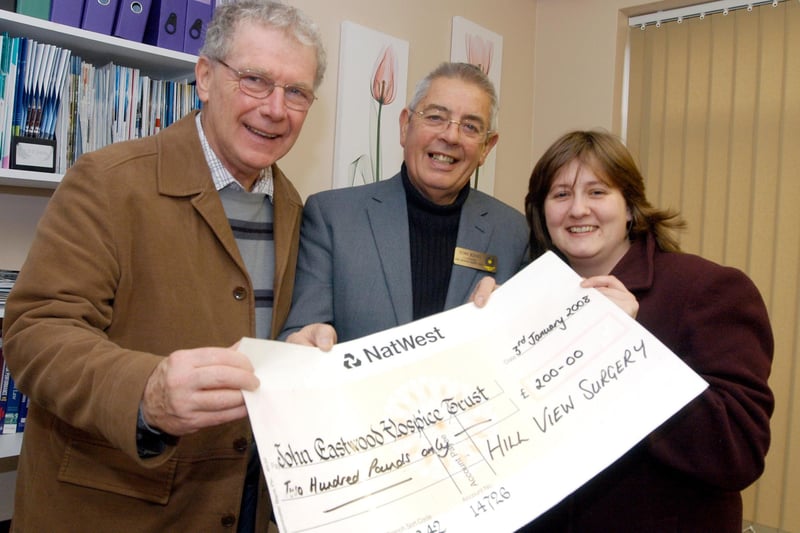 Patients at Hill View Surgery Rainworth present £200 to Tom King (centre) Chairman of John Eastwood Hospice after they arranged a collection at the surgery over Christmas Pictured are left Martin Coffey and Theresa Goodhand.