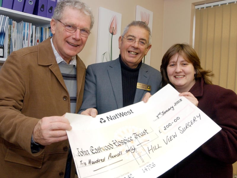 Patients at Hill View Surgery Rainworth present £200 to Tom King (centre) Chairman of John Eastwood Hospice after they arranged a collection at the surgery over Christmas Pictured are left Martin Coffey and Theresa Goodhand.