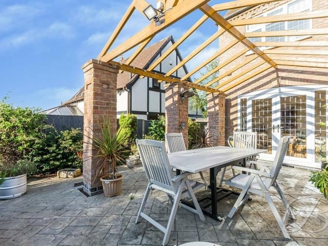 This patio sits under a pergola, with space for full al fresco dining. It is accessible from one of two sets of patio doors on the ground floor of the £475,000 house.