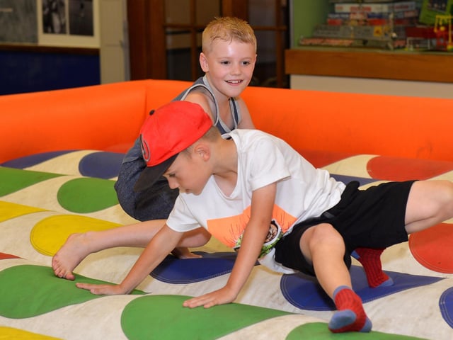 Giant inflatable twister game at Mansfield Museum, pictured are Brad, eight and Ben, seven in 2018.