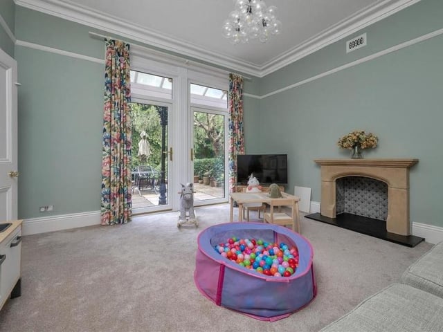 A second shot of the family room, showing the patio doors that lead to the front terrace.
