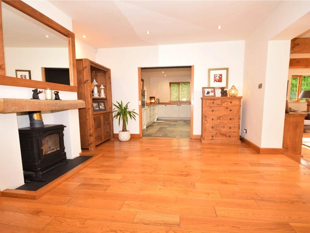 The reception hall boasts a feature fireplace with cosy log-burner, ensuring a warm welcome.