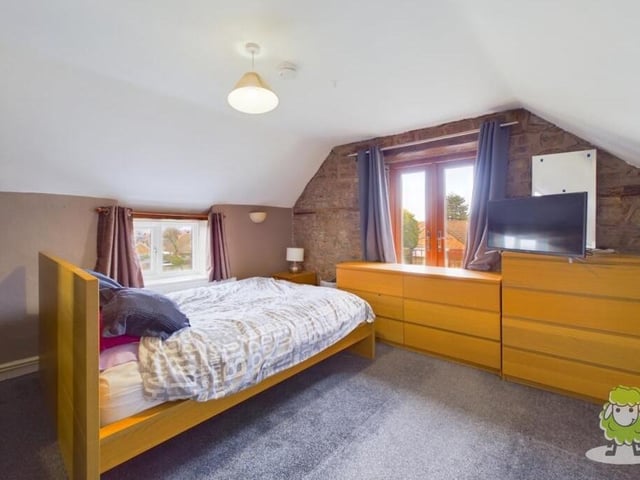 The largest of the five bedrooms at the Kirkby farmhouse is this master, which comes with a balcony, offering spectacular views.