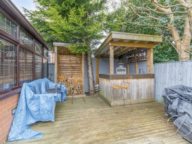The attractive rear garden is topped off by this quirky outdoor bar. Are we sure this isn't poolside at a five-star hotel in Gran Canaria, rather than Edwinstowe?
