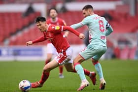 Joe Lolley breaks past Matt Grimes during the 1-0 defeat at home to Swansea City. (Photo by Laurence Griffiths/Getty Images)