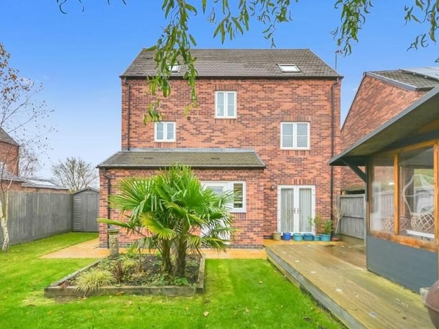 Another shot from the rear, showing the enclosed garden in all its glory. You can also see the French doors that lead outside from the lounge.