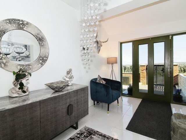 This grand entrance hallway welcomes you inside the majestic property.