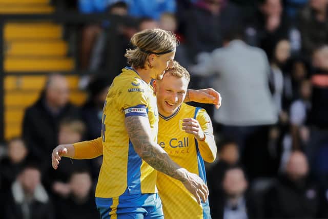 George Maris congratulates Aden Flint on his goal during the Sky Bet League 2 match against Notts County
Photo Chris & Jeanette Holloway / The Bigger Picture.media