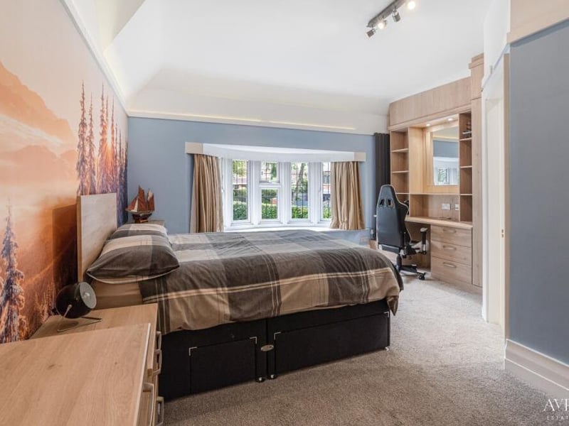 Another of the six attractive bedrooms at the High Oakham Road property. This one has desk space.