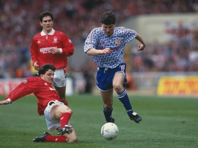 Dennis Irwin of Manchester Utd holds onto the ball as Nigel Clough looks on during Forest's 1-0 defeat to Manchester United in the 1992 Rumbelows Football League Cup final.Clough won 2 League Cups and 2 Full Members' Cup during his playing career.