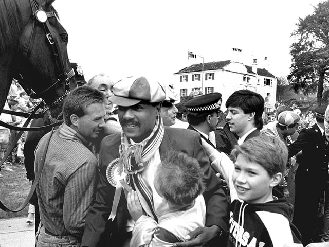 Celebrating with fans.