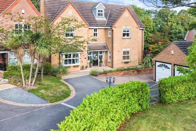 The six-bedroom property, spread over three floors, makes for a majestic sight. To the right is The Paddock, its front garden, and also a double garage.