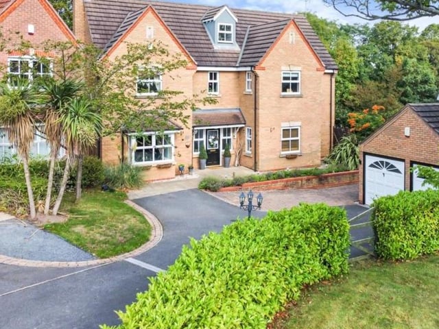 The six-bedroom property, spread over three floors, makes for a majestic sight. To the right is The Paddock, its front garden, and also a double garage.