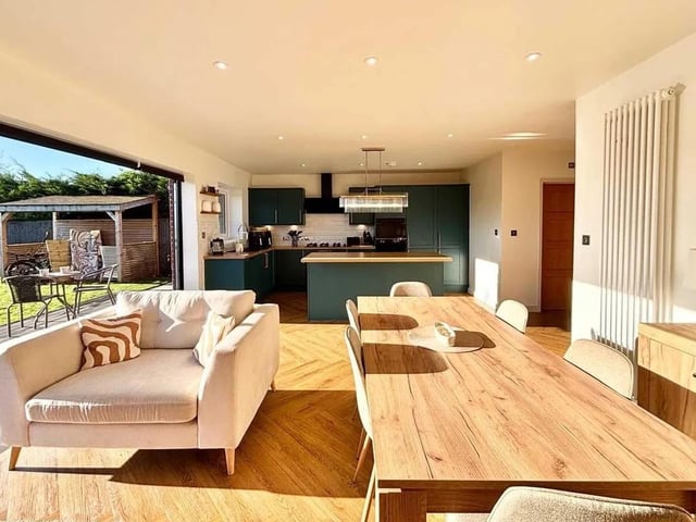 The open plan dining kitchen offers additional living space, ample room for family dining or entertaining guests.