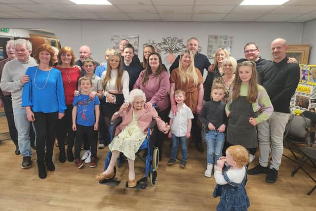 Lillian surrounded by friends and family on her birthday.