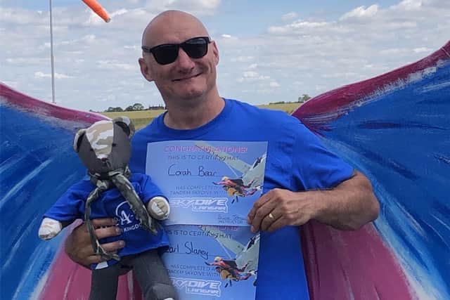 Proud father Carl is pictured after completing the big jump.