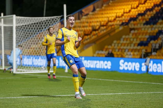 Mansfield Town's Callum Johnson celebrates his late winner against Doncaster Rovers.
