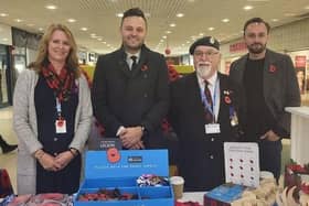 Mansfield's MP Ben Bradley selling poppies with members of the Royal British Legion.