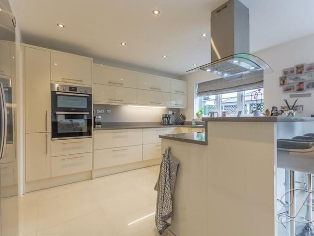We begin our tour of the £620,000 property in the heart of the home, which is the large and beautiful open-plan kitchen, diner and living area. It's bright and spacious, with integrated appliances including an eye-level double oven.
