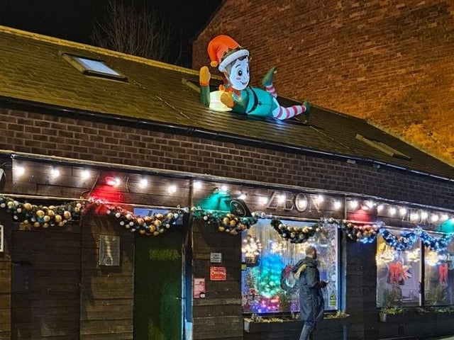 Local businesses are also colourfully lit up for Christmas.