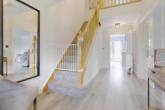 As you progress down the hallway, appreciating immediately the property's underfloor heating, there are the stairs on your left. But we need to take a look at the ground floor first.