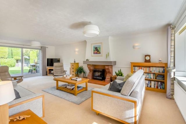 First stop on our photographic tour of the £700,000 Orchard Lodge is this large and lovely lounge. A dual-aspect room, it features double-glazed, sliding patio doors that lead out to the rear garden.;