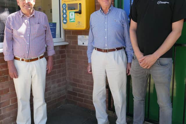 From left, Mansfield Harriers secretary David Lisgo, Rotarian John Whiteley, and Bobby Thorpe, of Thorpe Electrical Solutions, with the defibrillator.