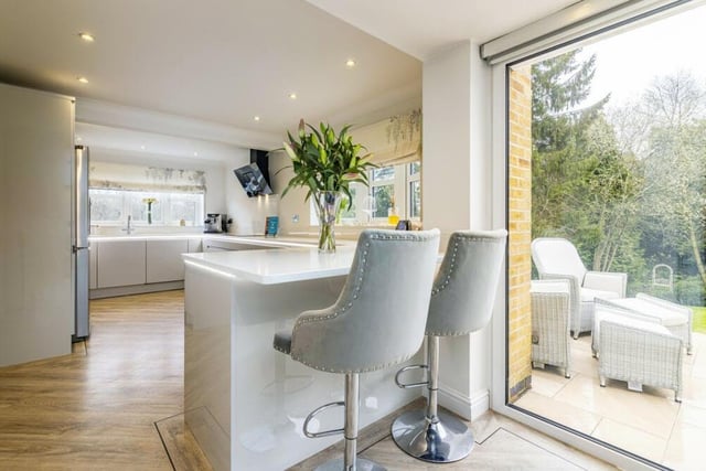 A good-sized peninsula adds to the appeal of the bright and contemporary kitchen/breakfast room