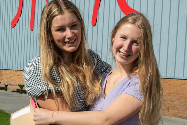 Friends Emily Hitchcock and Thea Bryant were all smiles after receiving their results