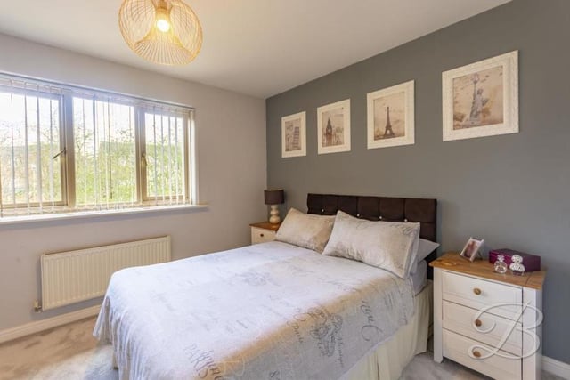 Both bedrooms are well appointed and of a similar size. This is the first one, which overlooks the back of the £140,000-plus property. There is carpet to the flooring and a central heating radiator.