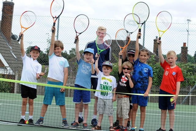 Coach Euan Burgess with some of the youngsters who attended a previous open day session at the Mansfield Lawn Tennis Club.