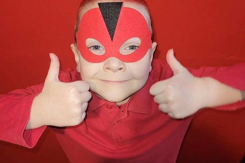 Youngster Eric was ready for Red Nose Day as a red super hero
