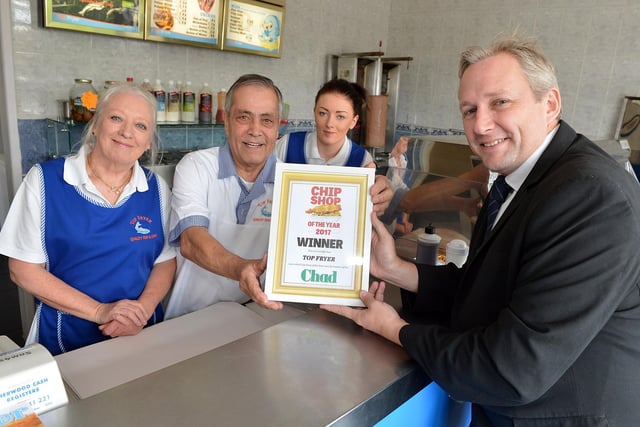 Presentation to the winner of Chad's chippy of the year, Top Fryer. 
Ann and Teyfik Marasli, co-owners and staff member Abbie Wilson pictured with Chad editor Jon Ball