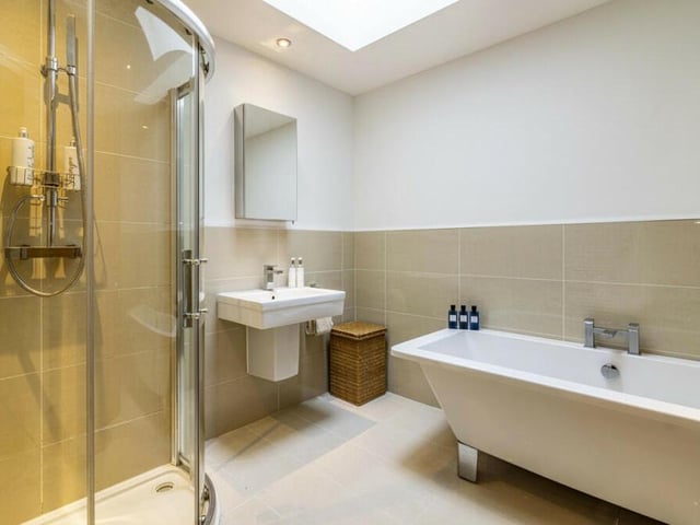 To complete our tour of the interior of the £750,000 house, here is the chic four-piece family bathroom on the first floor. It comes with a modern, free-standing bath and a separate shower cubicle.