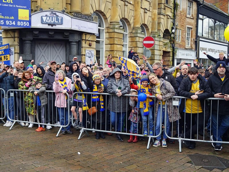 Crowds packed into Mansfield town centre this afternoon to salute their heroes.