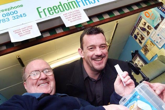 Ken Carnell, left, chairman of the Sutton Board of the Citizens Advice Bureau, drew the winning ticket for a new mobility scooter with Paul Guy, Director of Freedom First who had a shop at the Sutton indoor market.