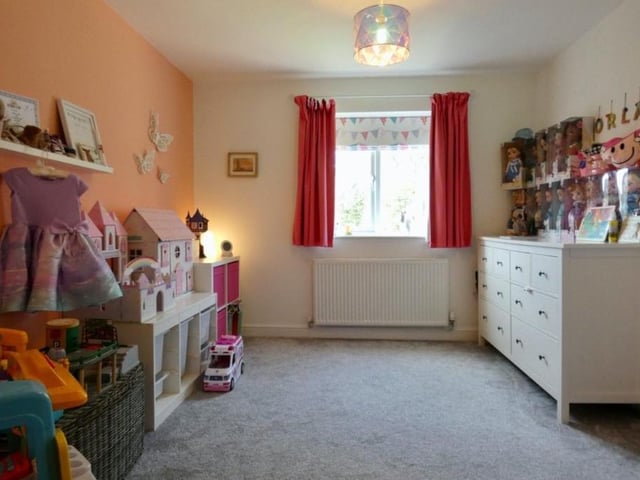 The second bedroom, which overlooks the back of the house, is a very good size.