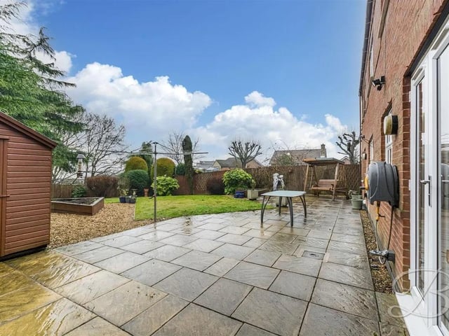 To the rear of the property, you will find a well maintained lawn with a patio seating area, this makes a wonderful space to enjoy the outdoors.