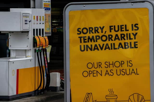 The kind of sign that has been springing up at service stations all over Mansfield. (PHOTO BY: Chris J Ratcliffe/Getty Images)