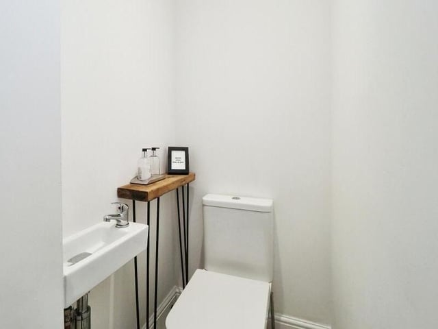 Also on the ground floor is this neat and rather cute toilet, with WC and wash hand basin.